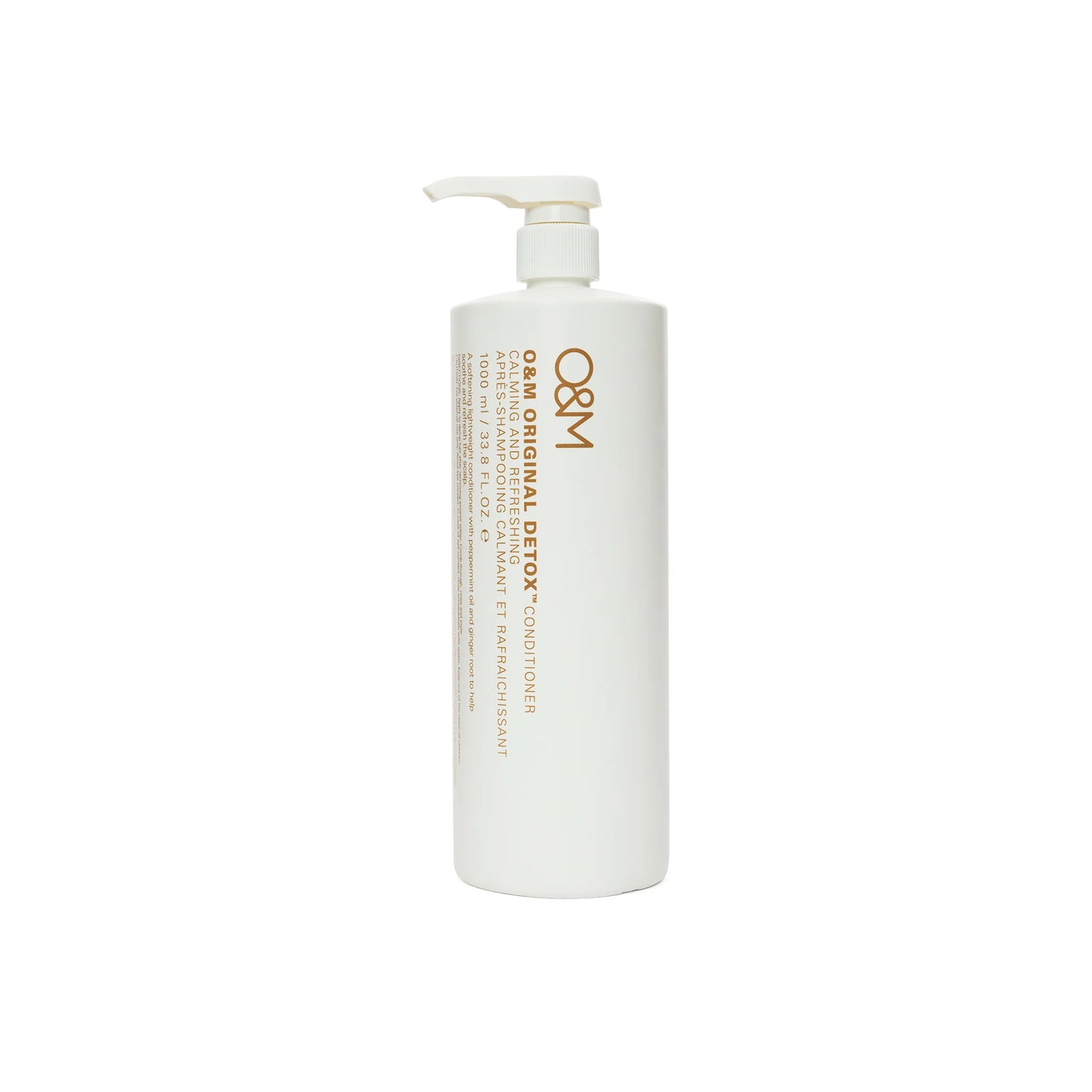 A white pump bottle of O&M Original Detox Conditioner with gold text, shown against a plain white background.