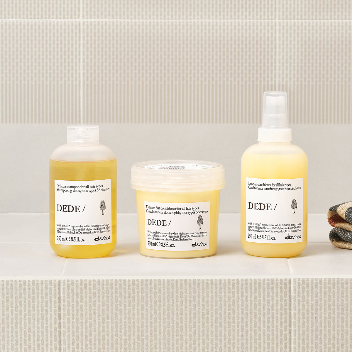Davines DEDE Conditioner shown in a styled bathroom setting
