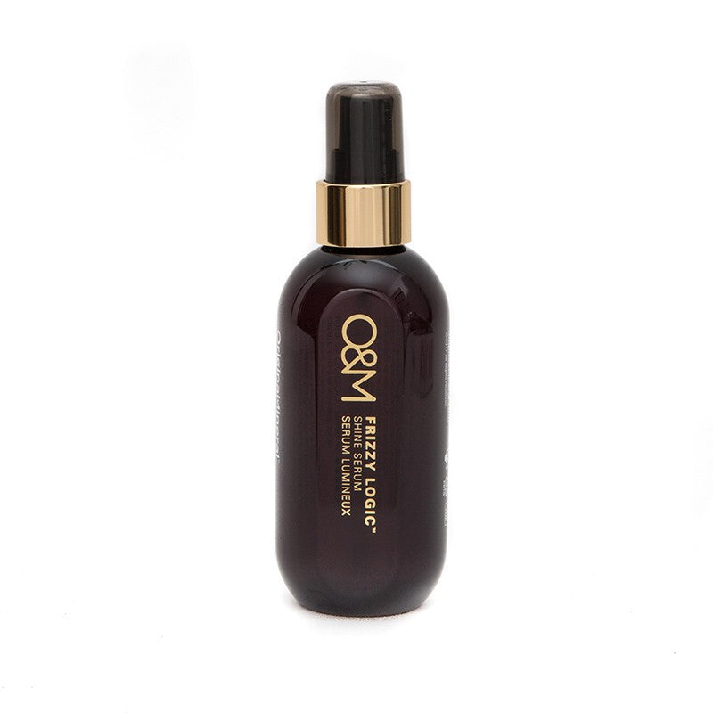 Dark brown serum bottle with gold cap on a white background