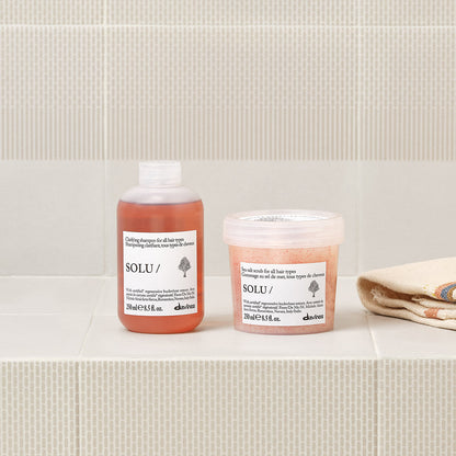 Lifestyle photo of Davines Solu Shampoo, clarifying shampoo for all hair types